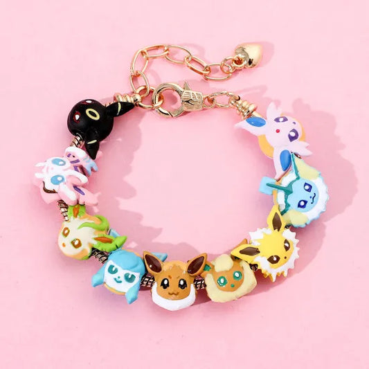 Bracelet with various cartoon character charms on a pink background